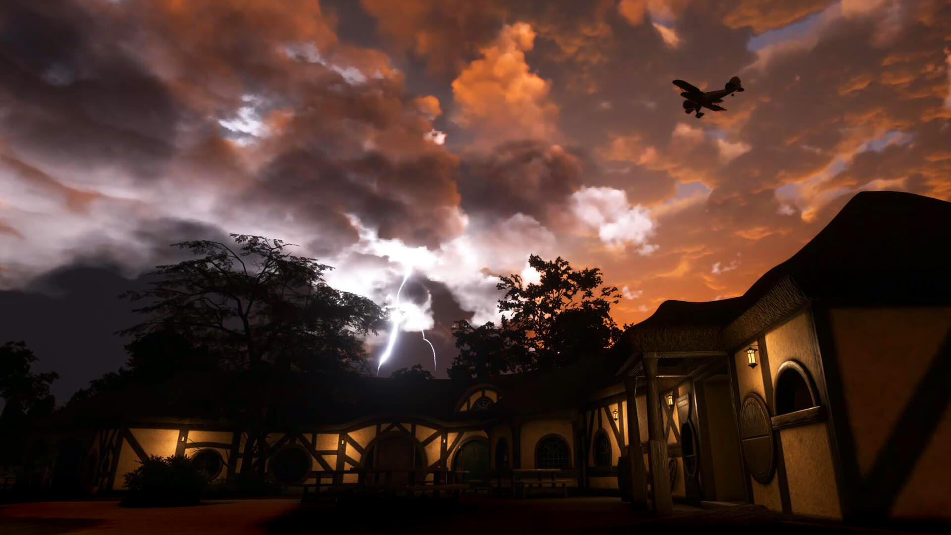 A bi-wing aircraft avoids stormy skies whilst flying above a thatched roof cottage.
