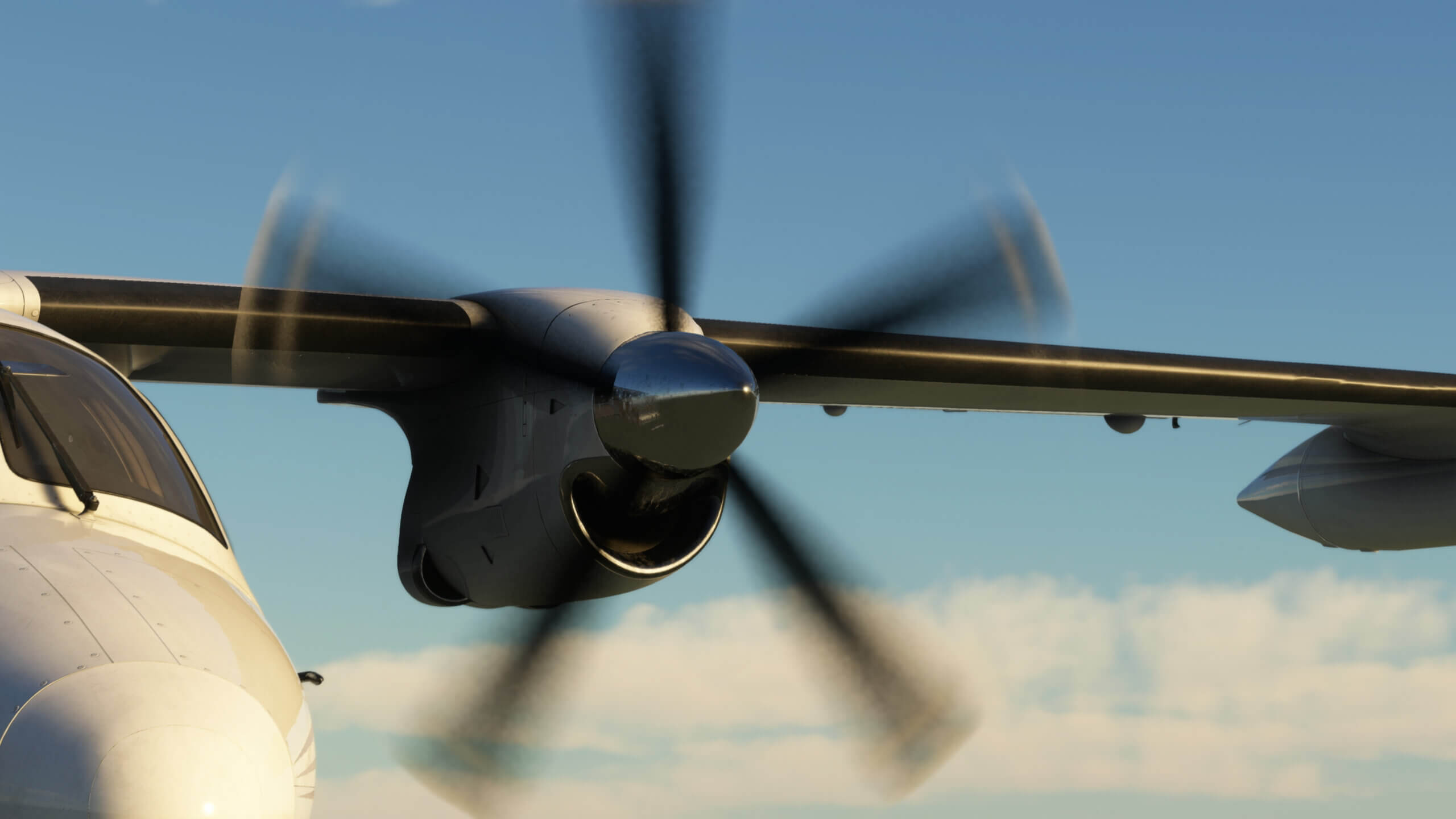 Close up of the left engine of an MU-2. The propellor is shown with motion blur.