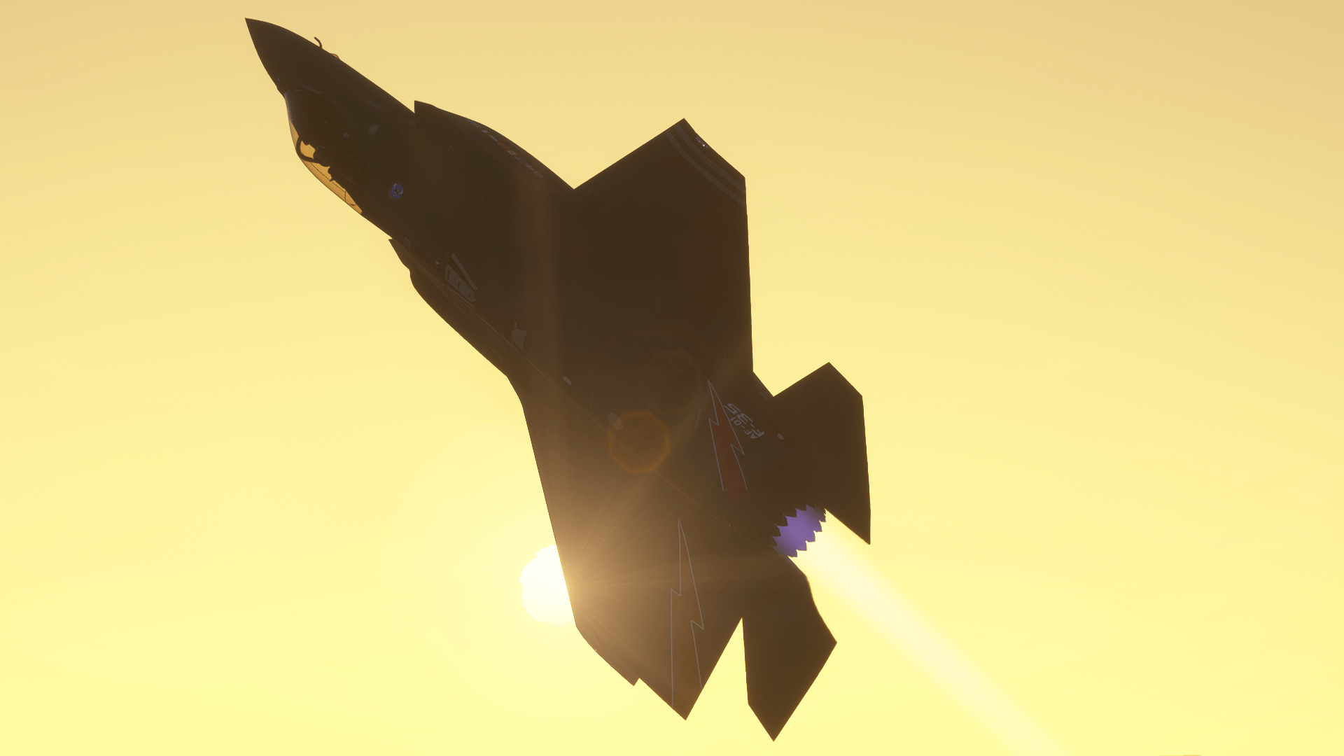 An F-35 pulls into an inverted stage of flight with the sun shining in the background