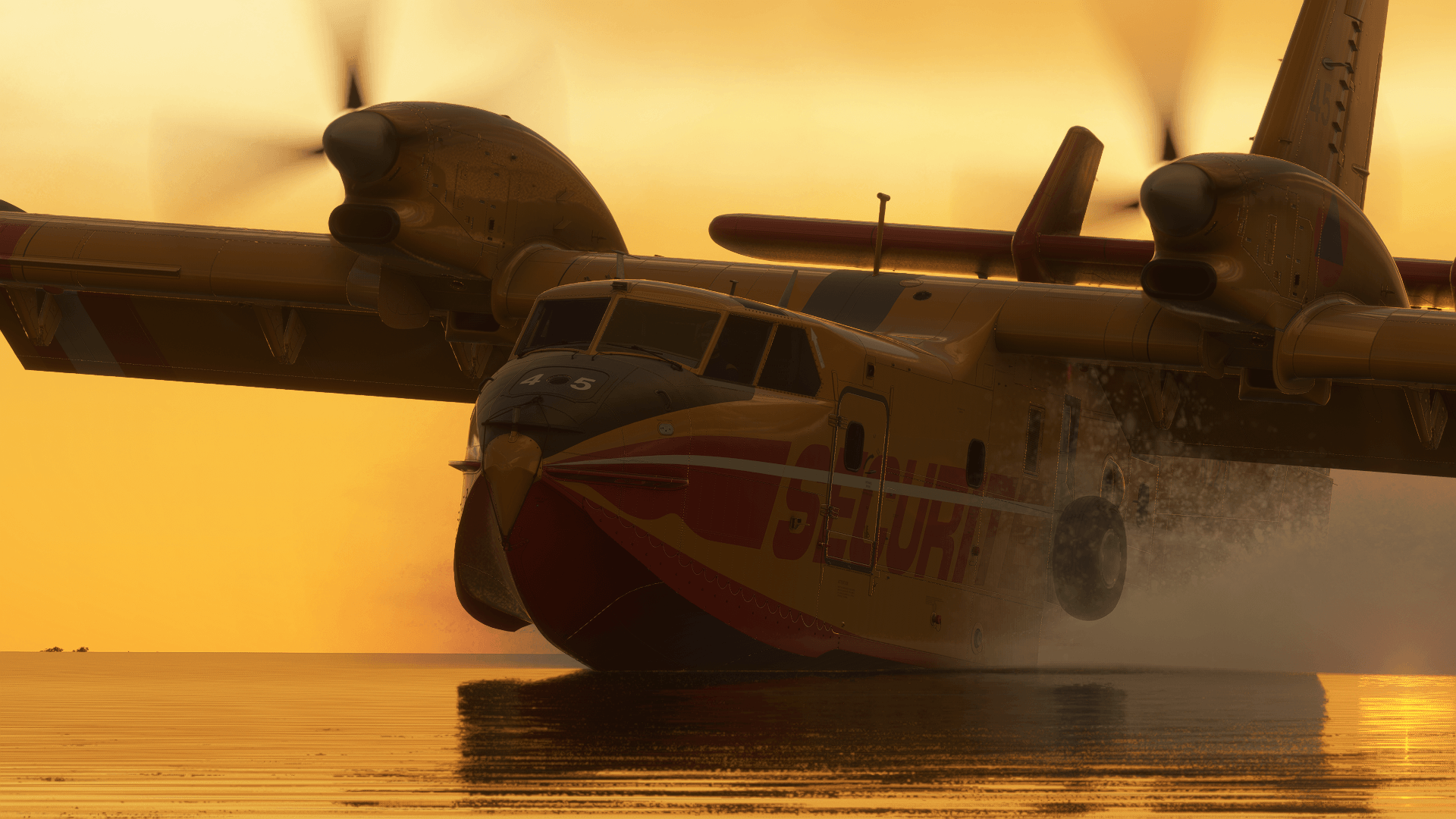 A fire fighting aircraft collects water from a lake