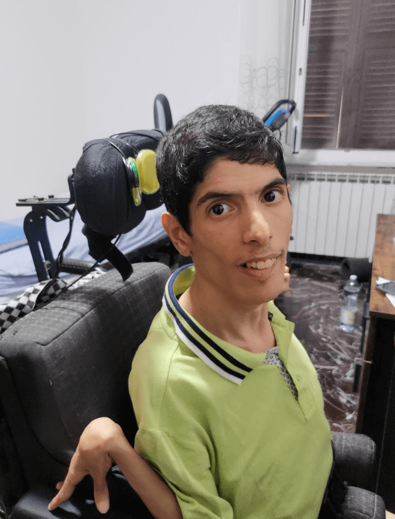 A different angle of Lillo sitting in his special head-controlled flight simulator chair